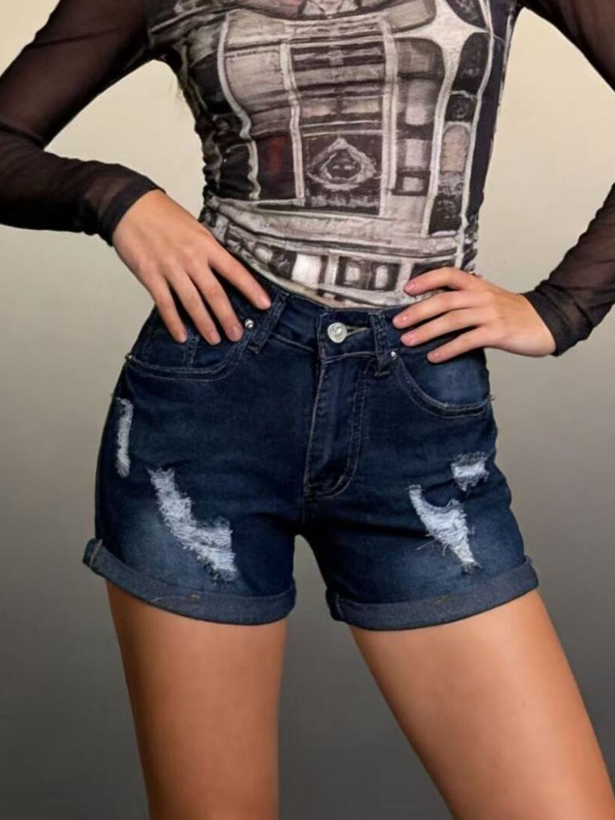 Side view of distressed jean shorts