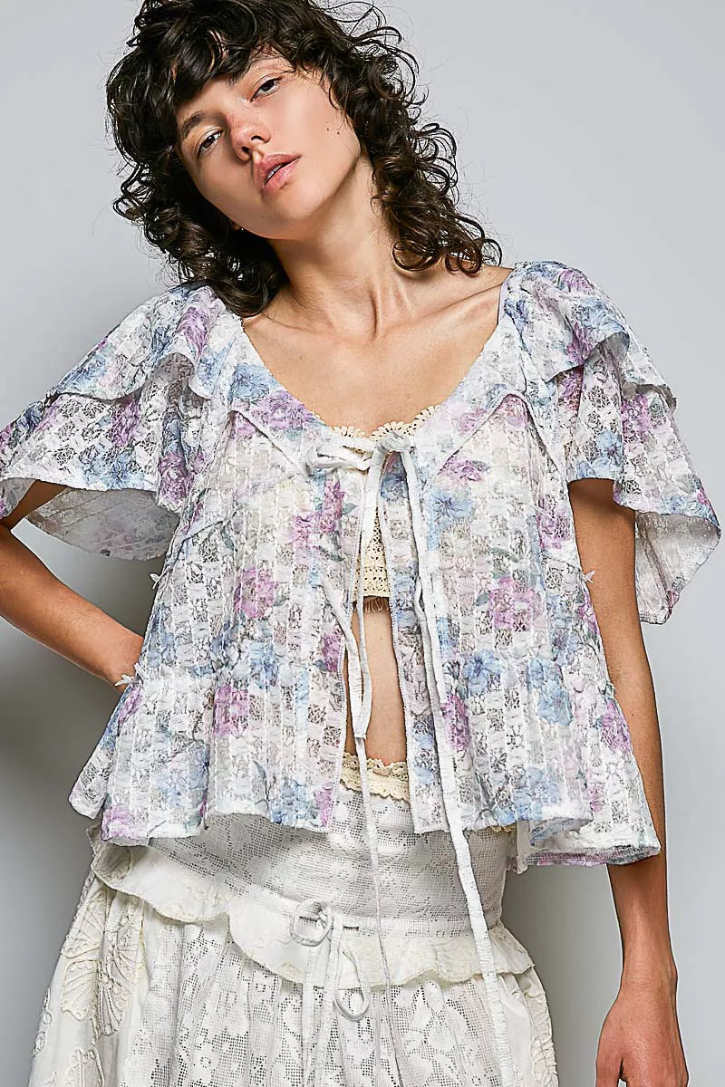 Off white floral lace blouse styled on model, side angle