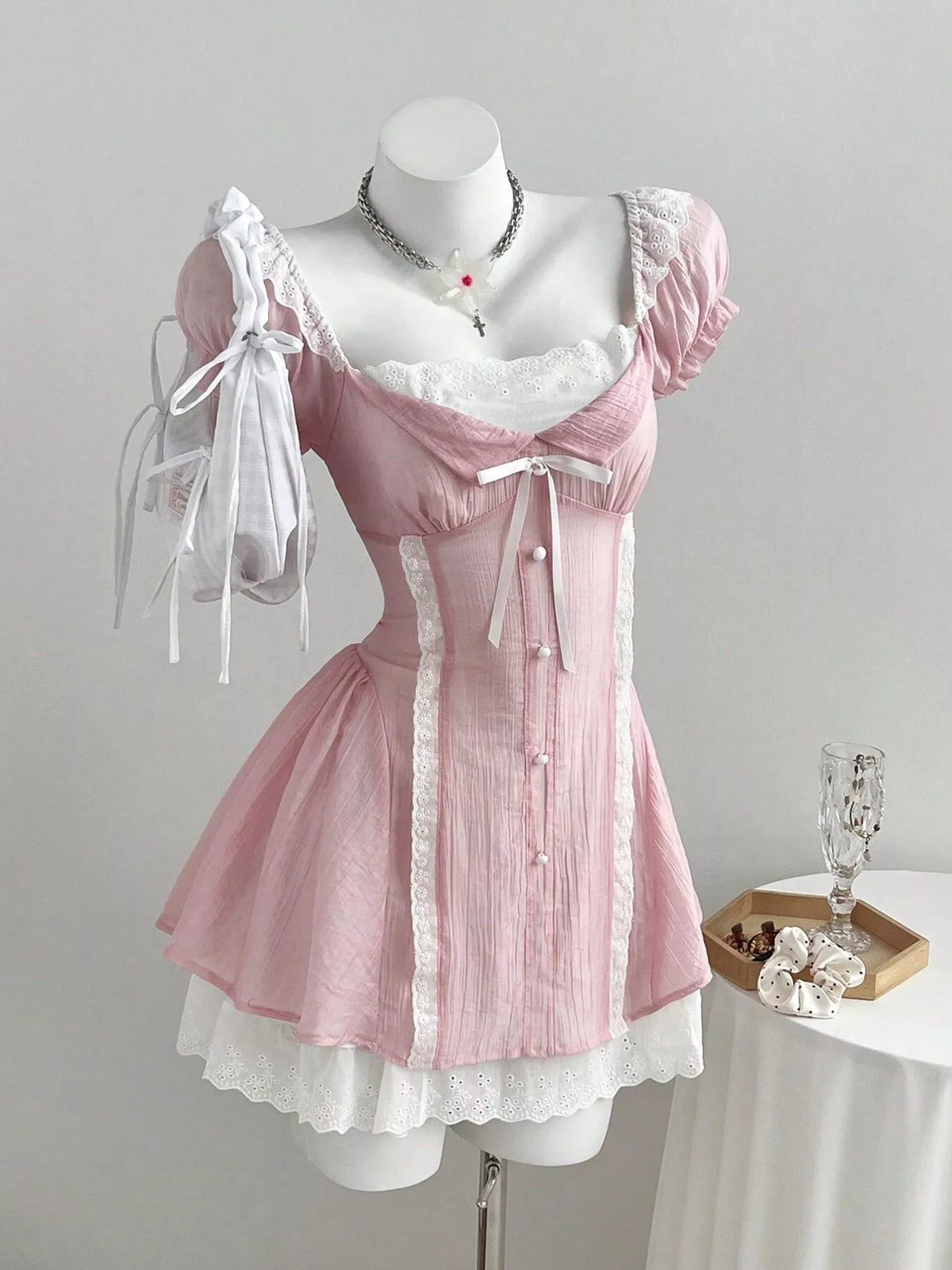Close view of the lace detail and ruffle trim on the dress