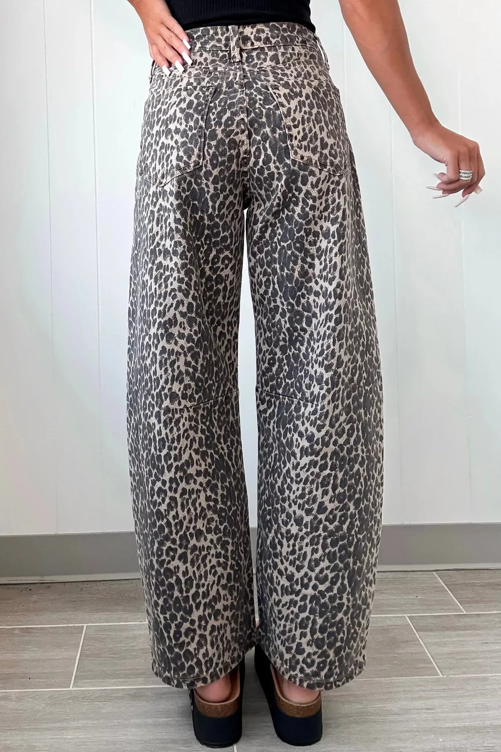 Barrel leg jeans side profile showing curved shape