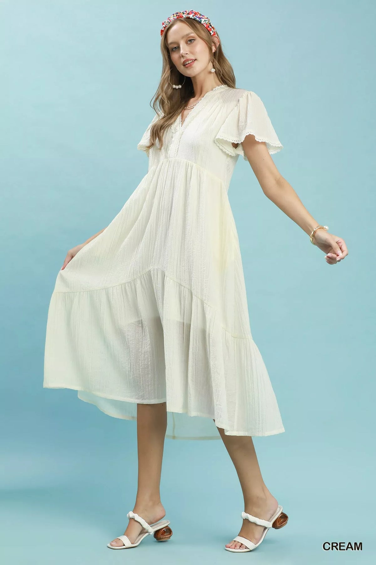 Cream textured lace trim tiered midi dress detail view