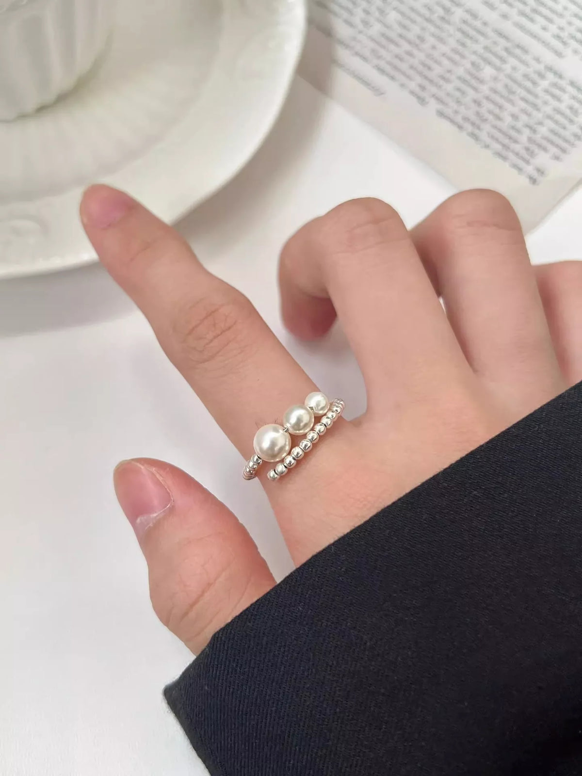 Triple pearl ring detail close up