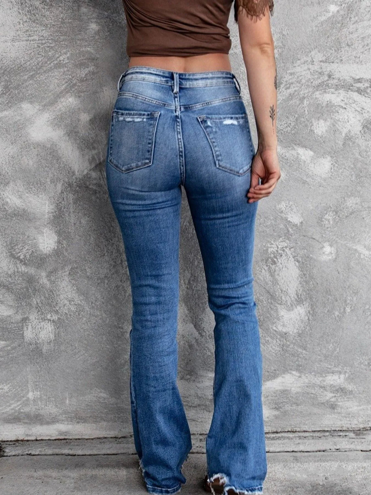 Black distressed flare jeans side view