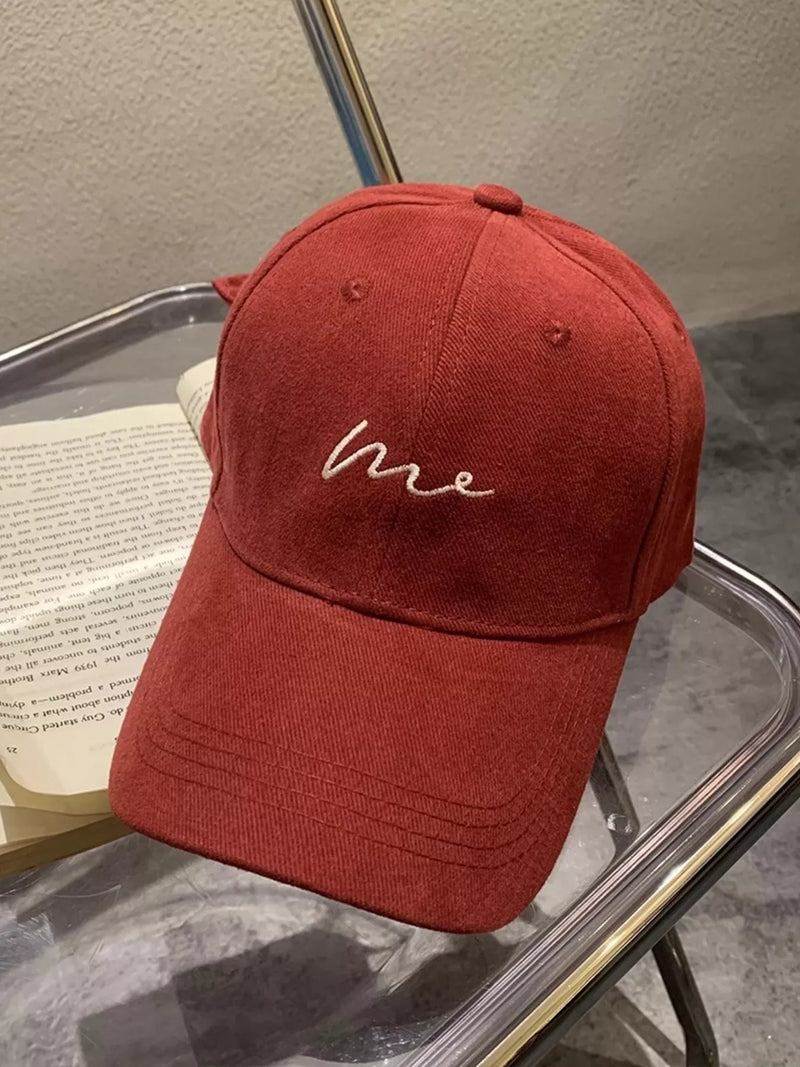 Embroidered letter baseball cap shown from the front