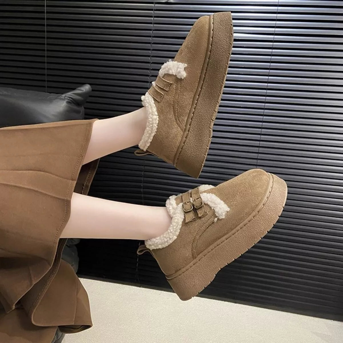 double buckle fur lined winter ankle boots pair angled view