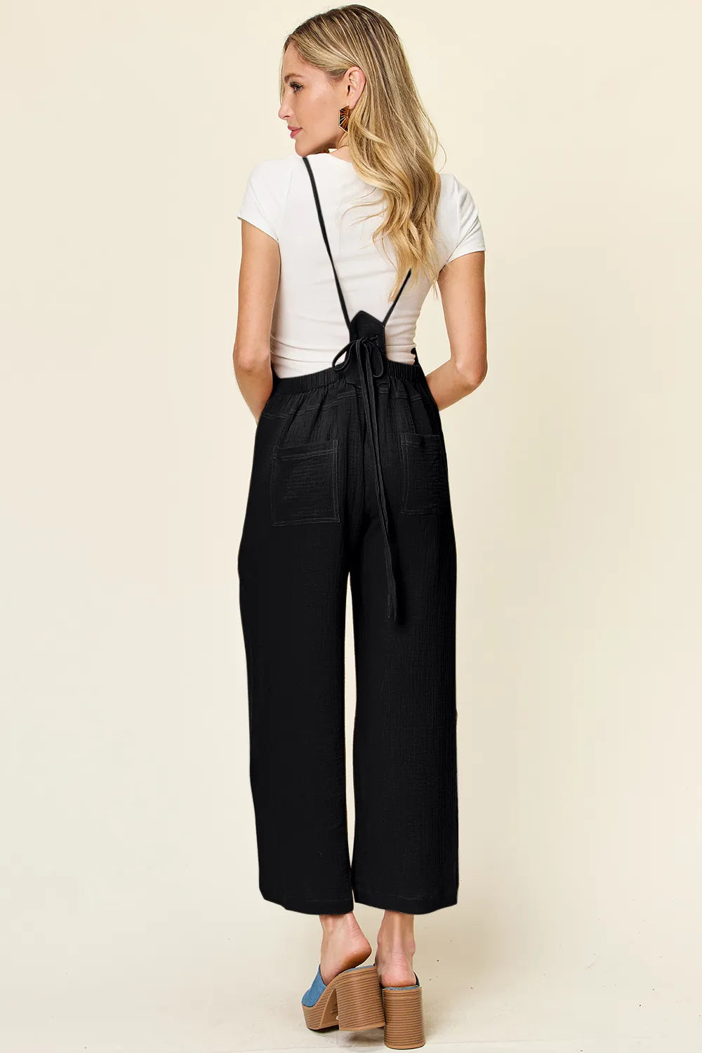 Side view of the sleeveless cotton overall