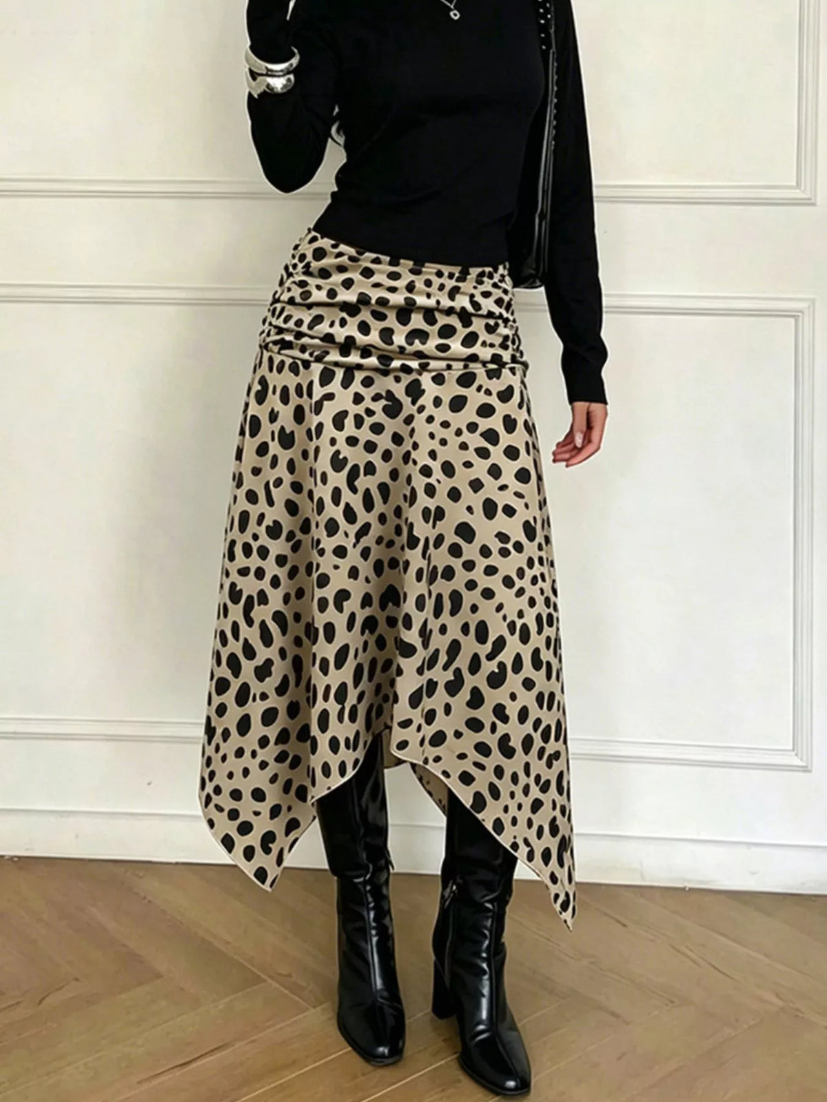 Asymmetrical hem detail on the leopard print skirt