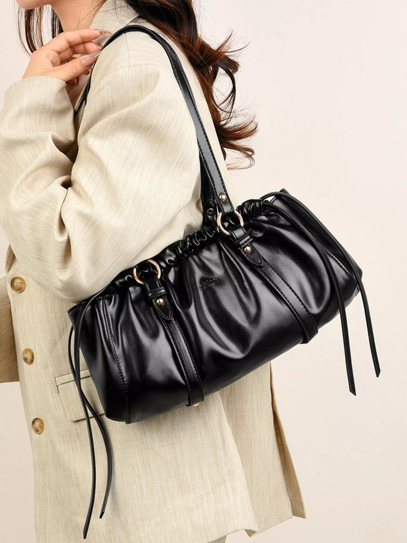 Ruched PU leather shoulder bag in black front view