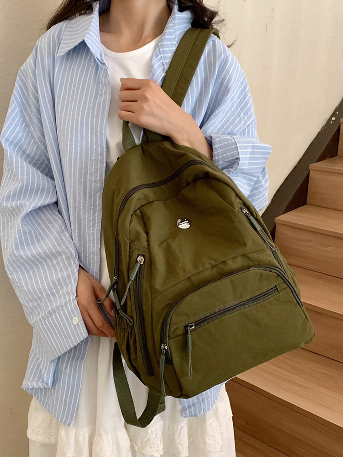Army green lightweight nylon backpack back and straps