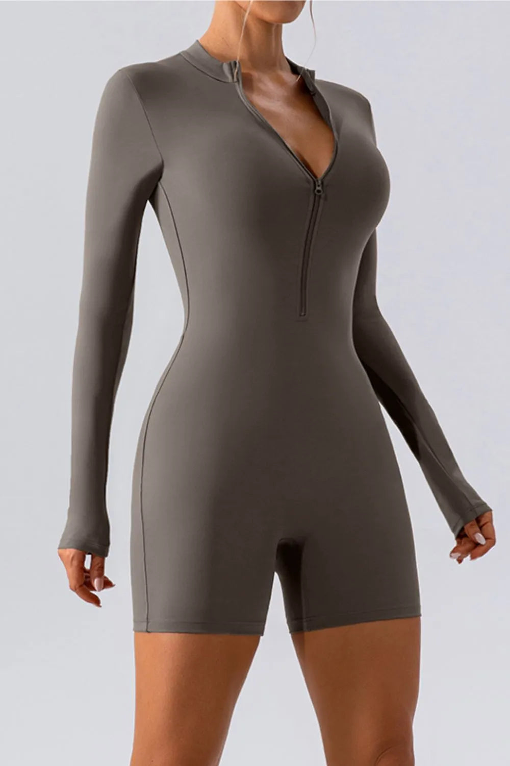 half zip active romper flat lay