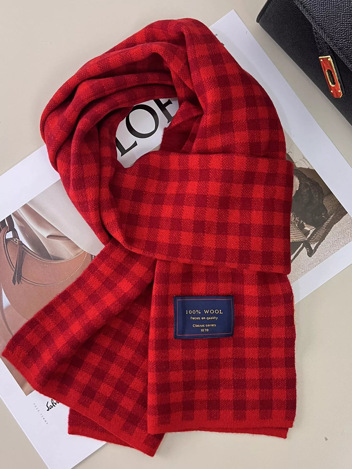 Wool plaid scarf draped long over the shoulders