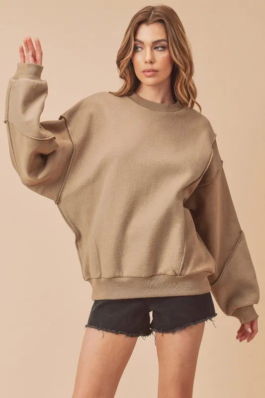 Exposed seam round neck drop shoulder sweatshirt in camel front view