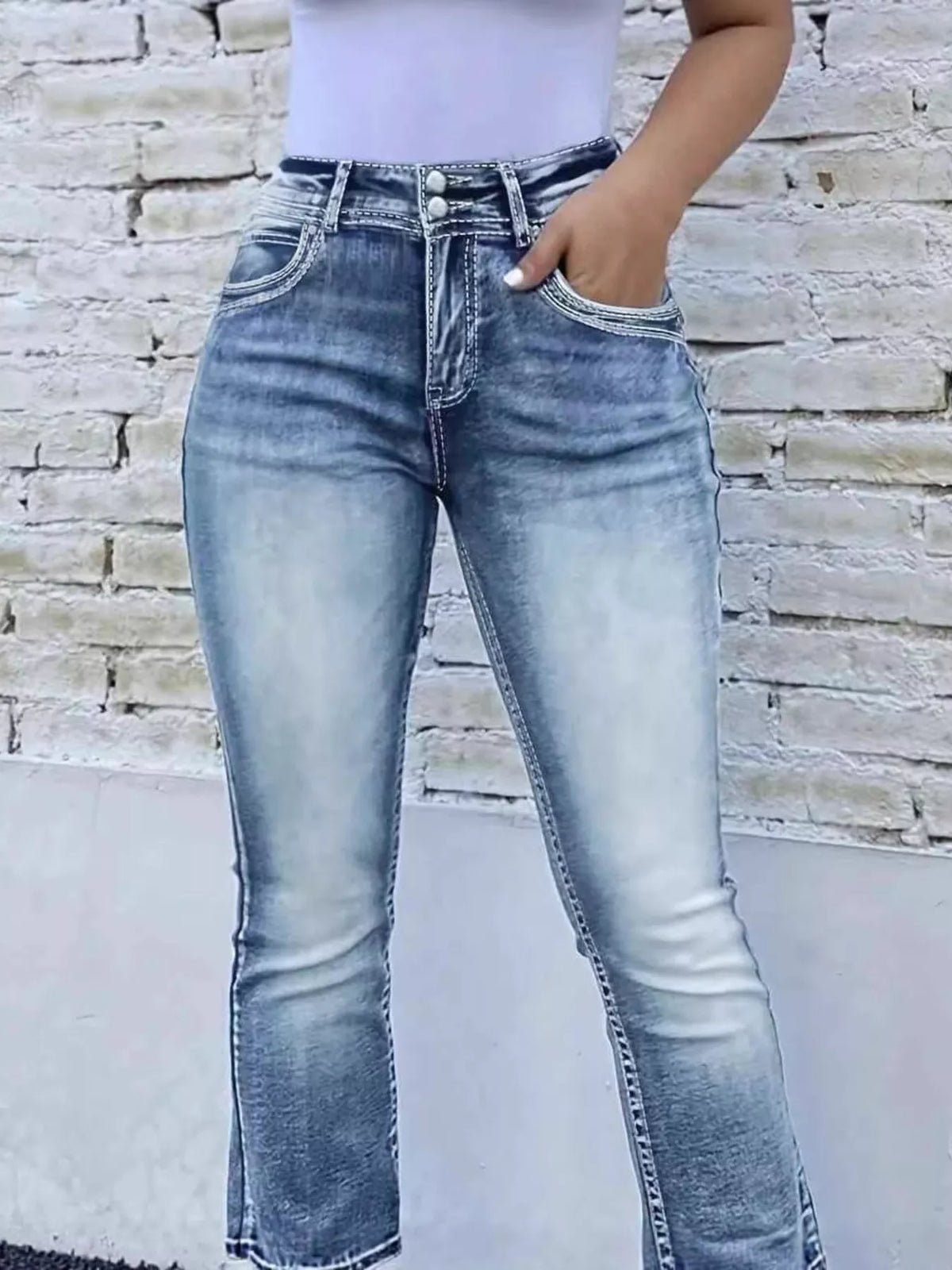 Side profile of bootcut jeans showing flared hem