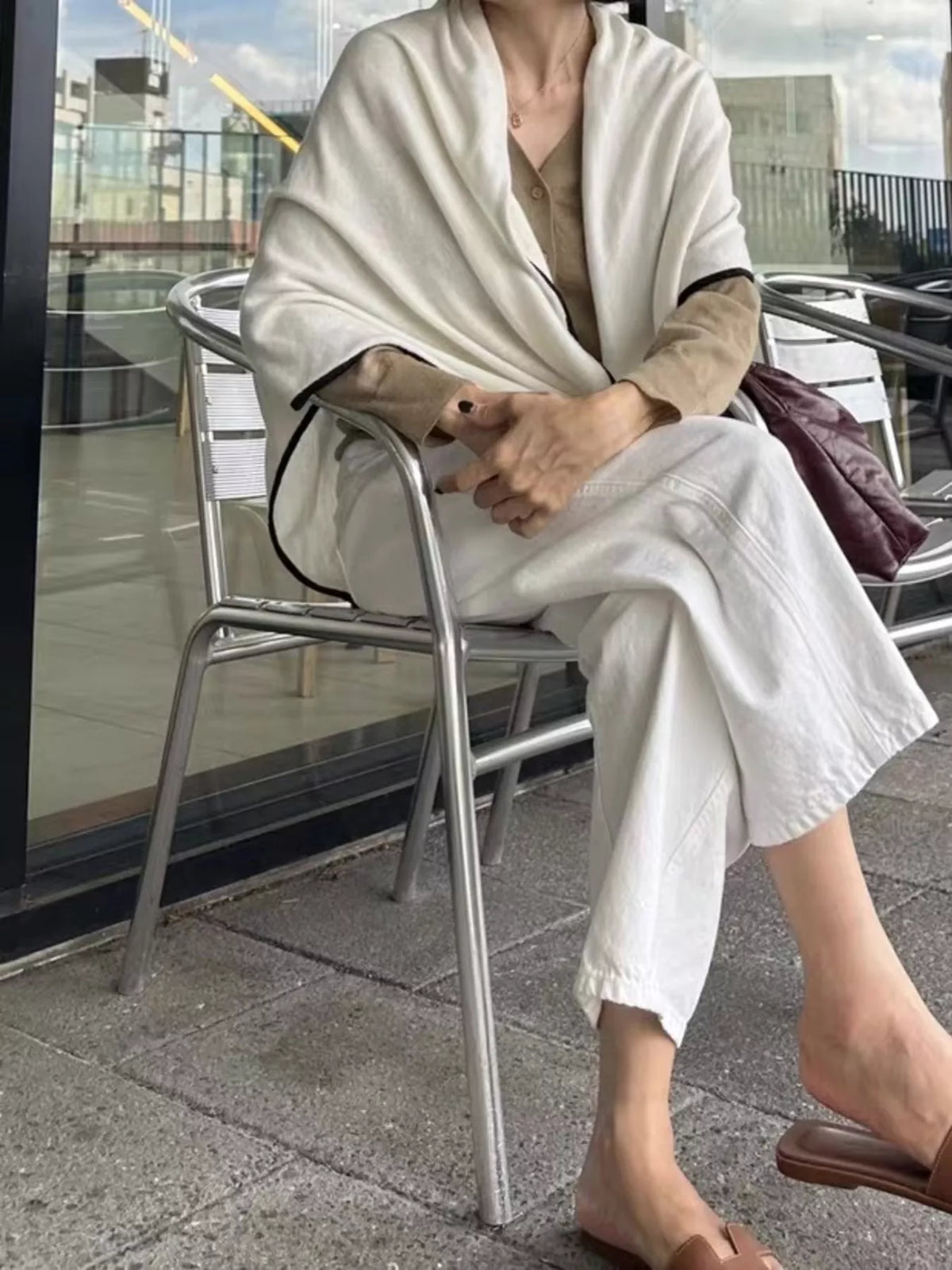 Neutral winter scarf looped for a cozy layered look