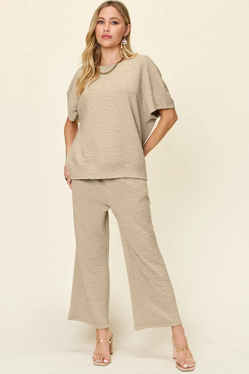 Textured short sleeve top and pants set front view on model