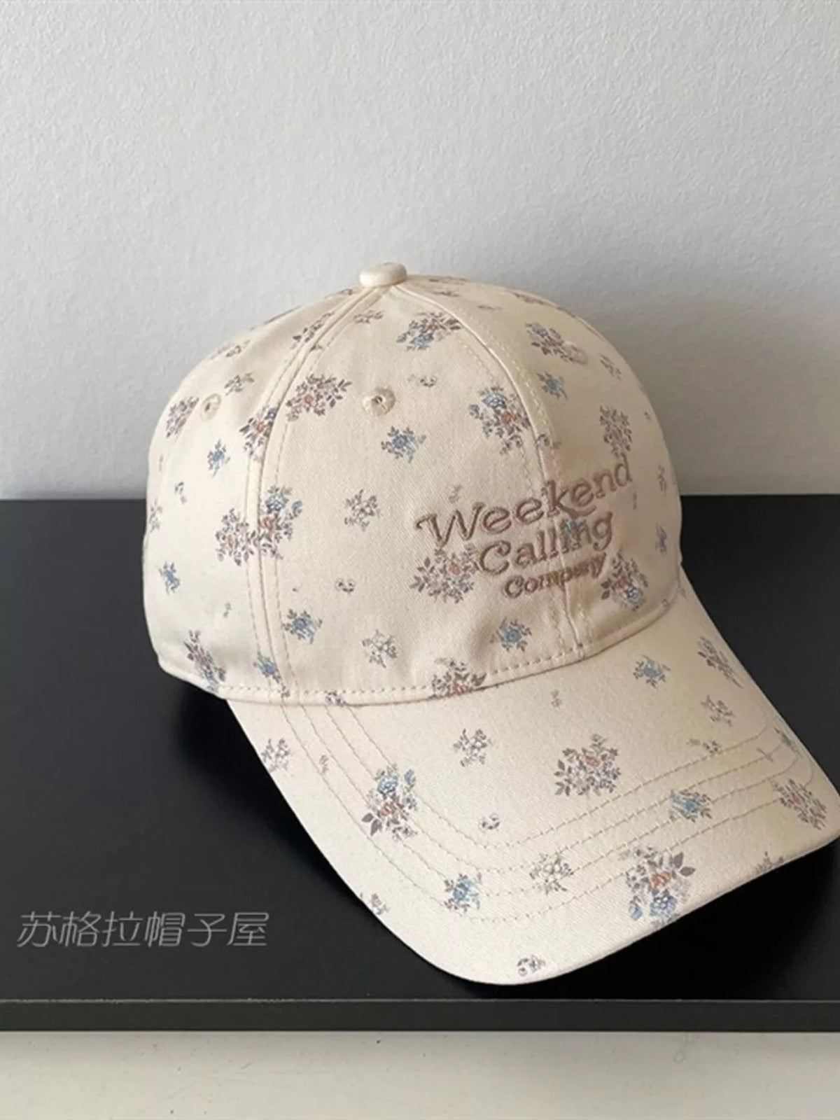 floral embroidered baseball cap close up detail