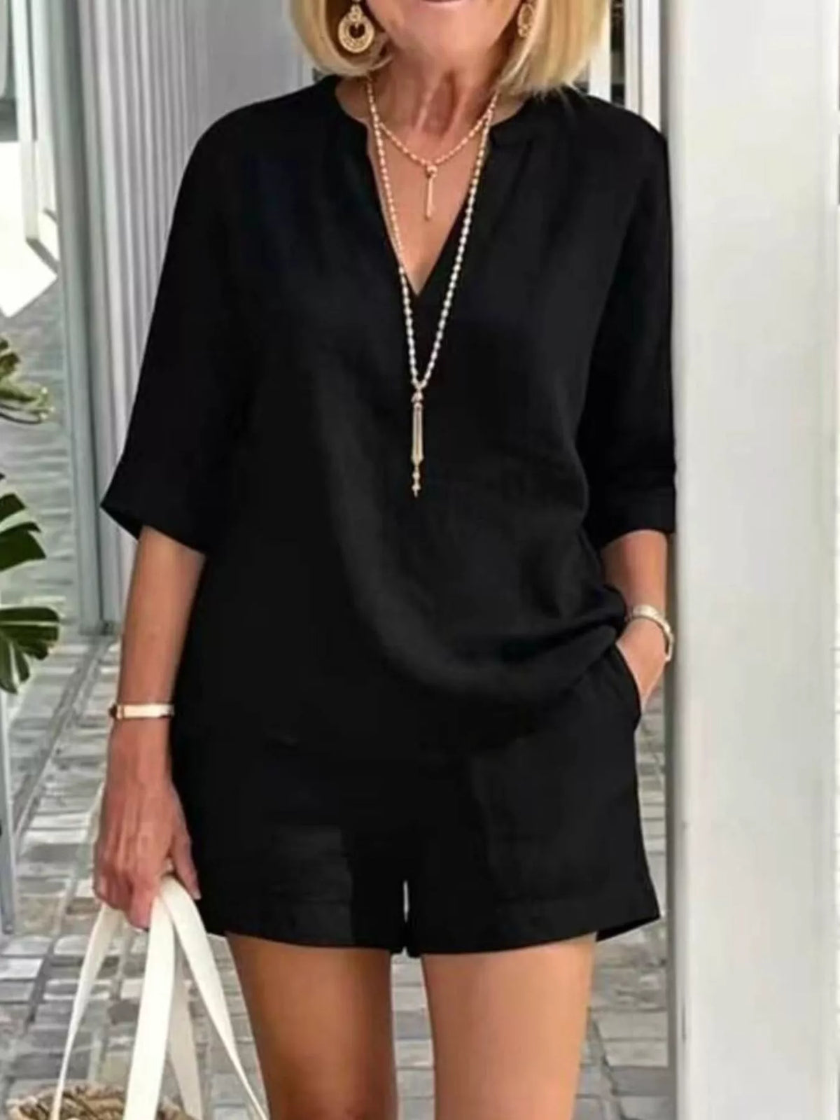 Side view of the womens two piece top and shorts set
