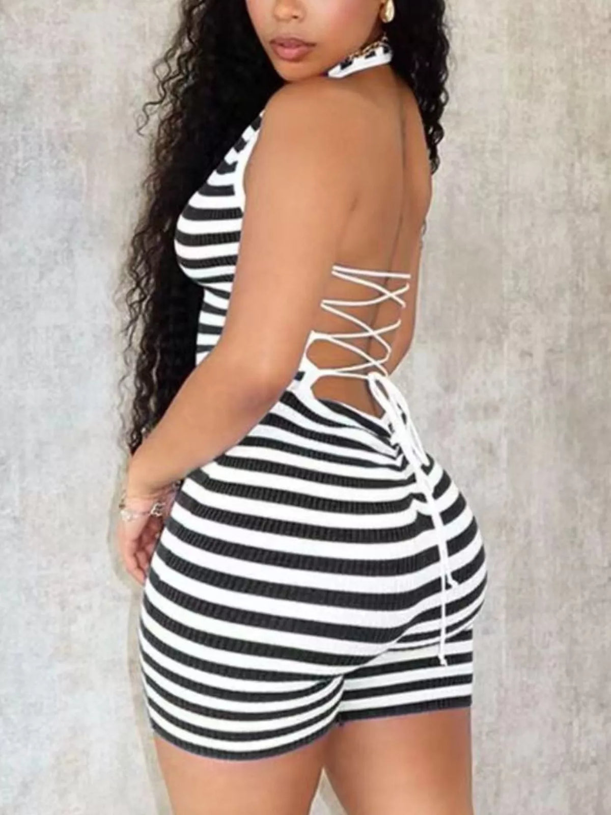 Black striped romper side view