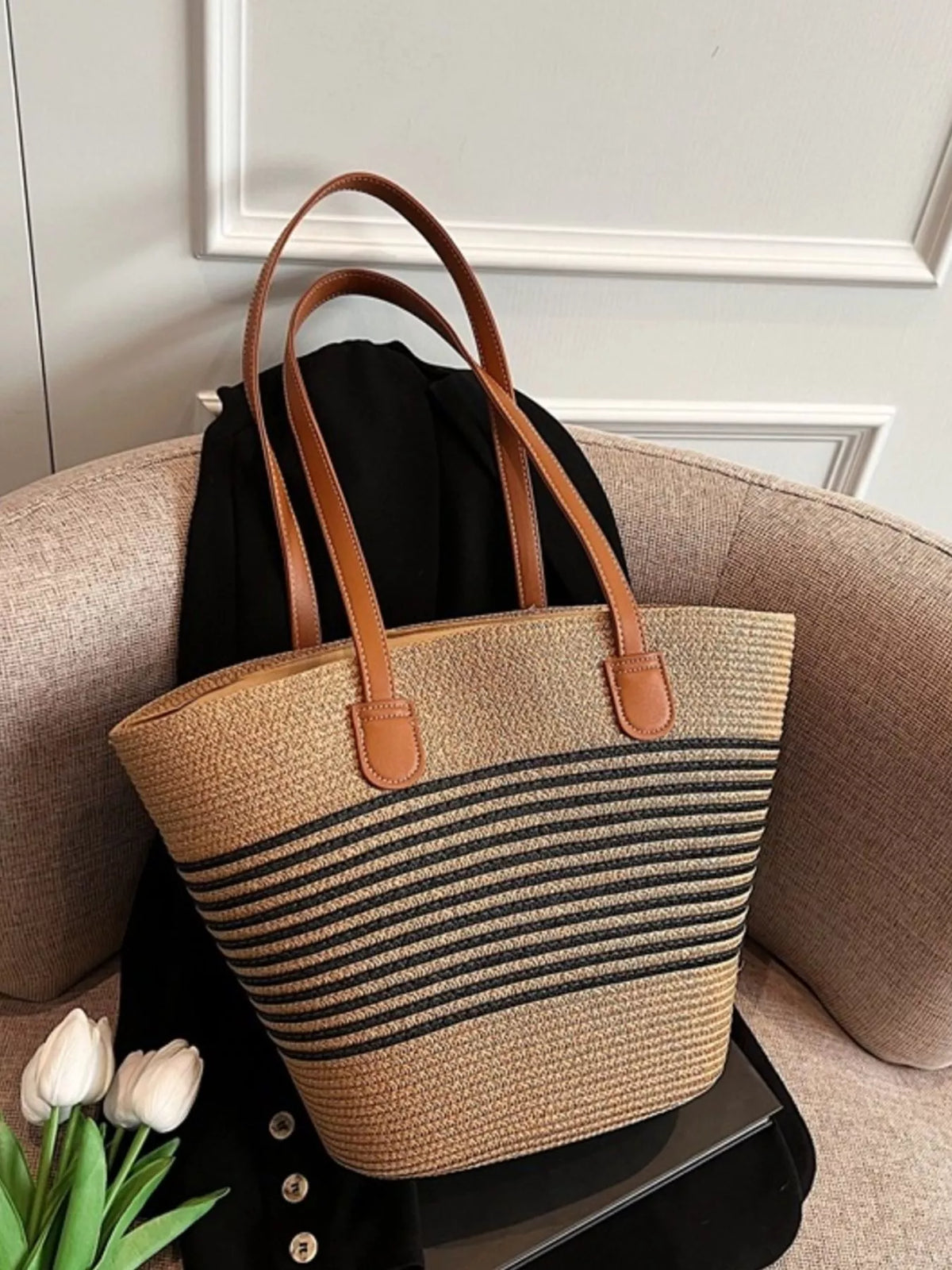 Black striped woven straw shoulder bag front view