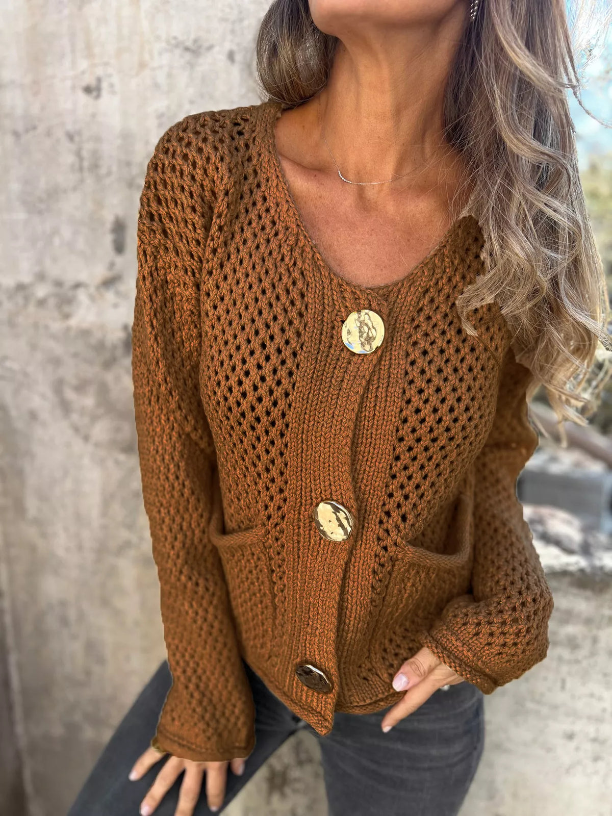 crochet button up cardigan worn with denim