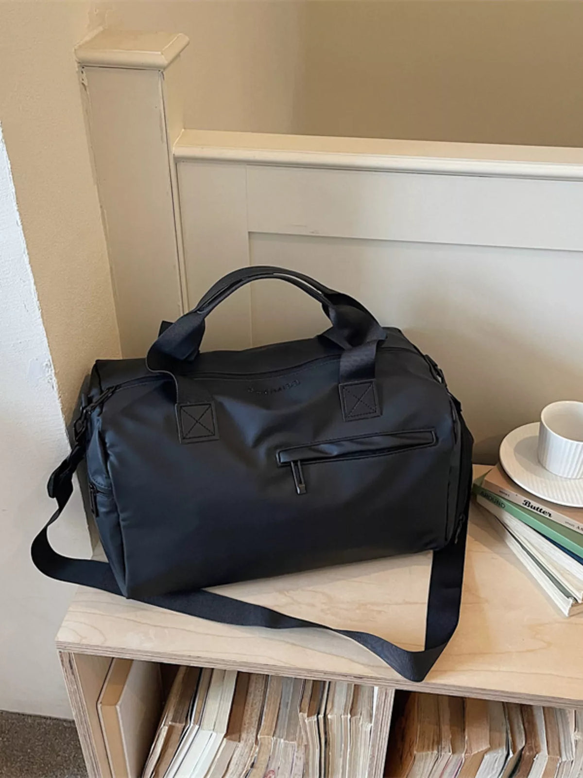 Black duffel bag side pocket detail