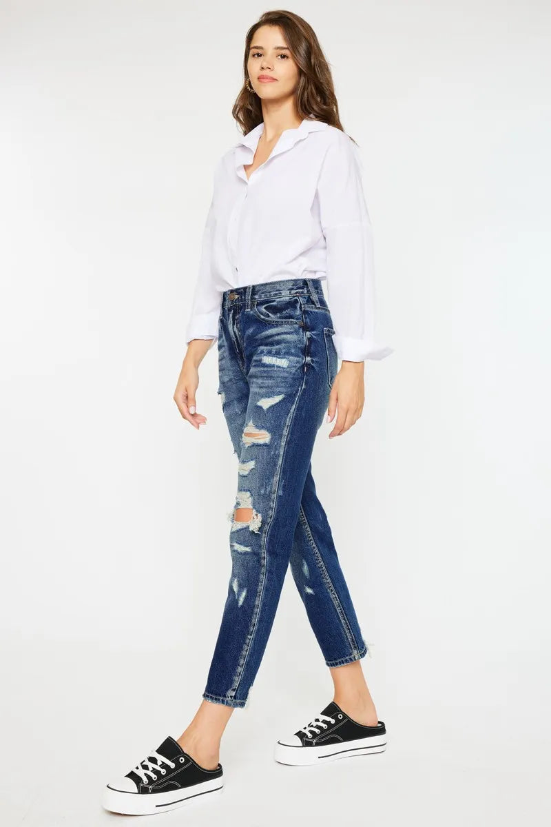 Distressing and whiskering detail on dark denim