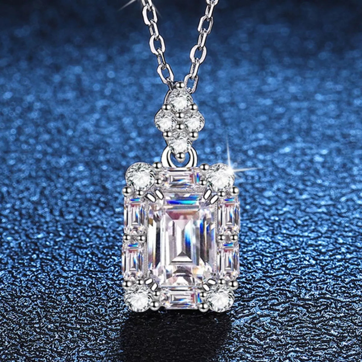 Halo moissanite pendant catching the light