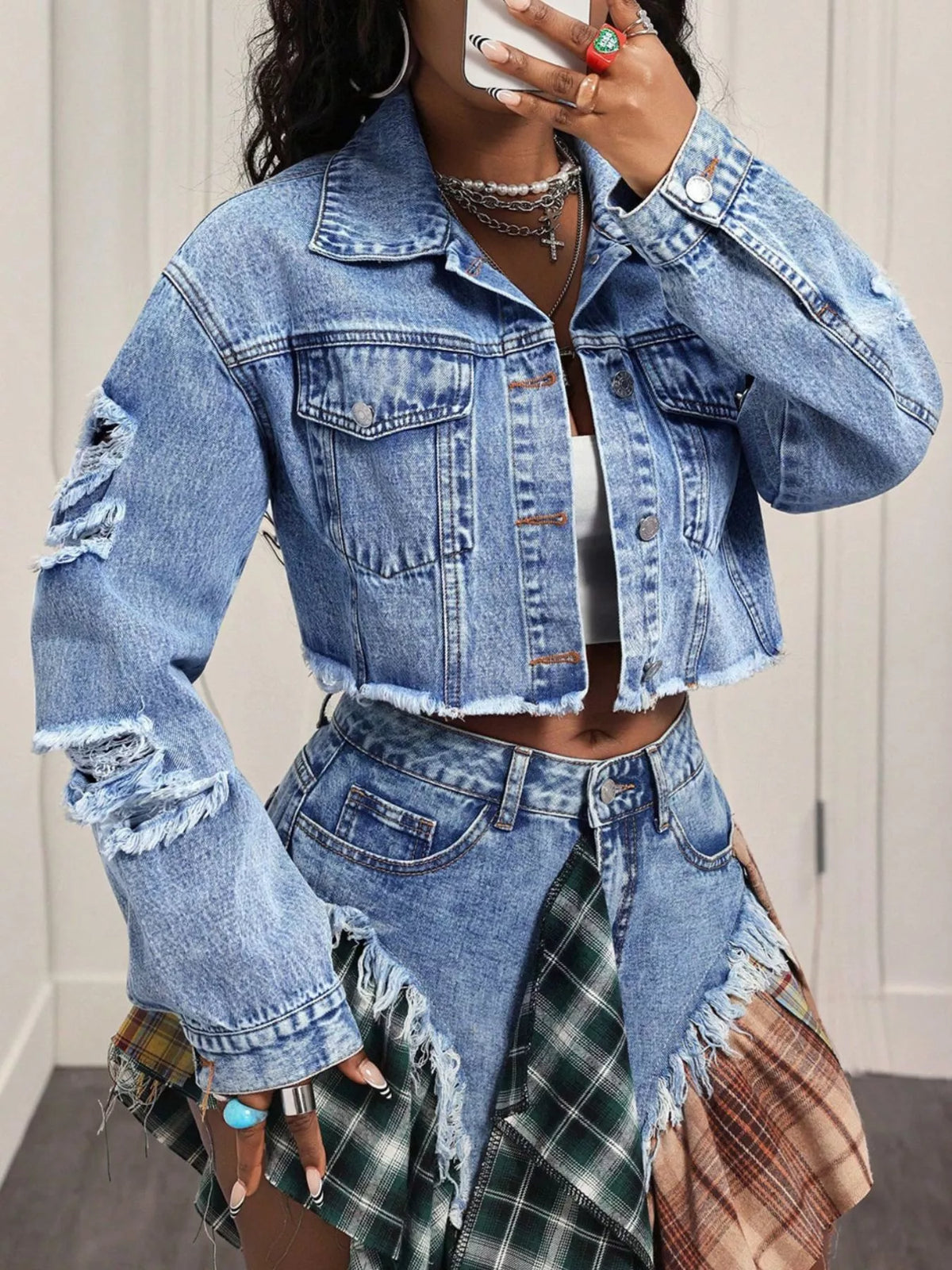 Raw hem detail on a cropped denim jacket