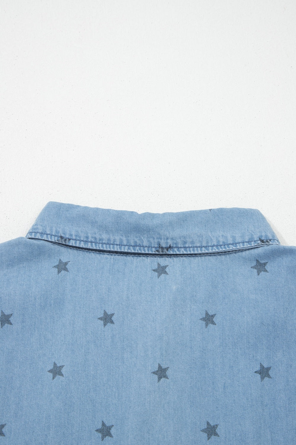 Light blue denim shirt close up of the collar