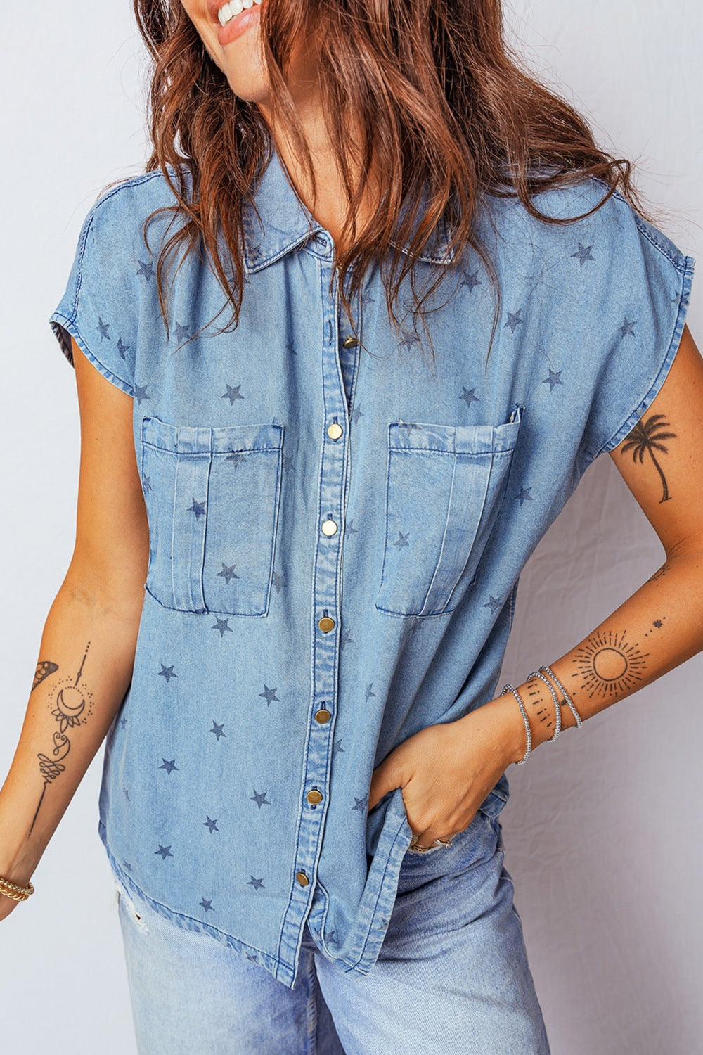 Light blue short sleeve denim shirt front view on model