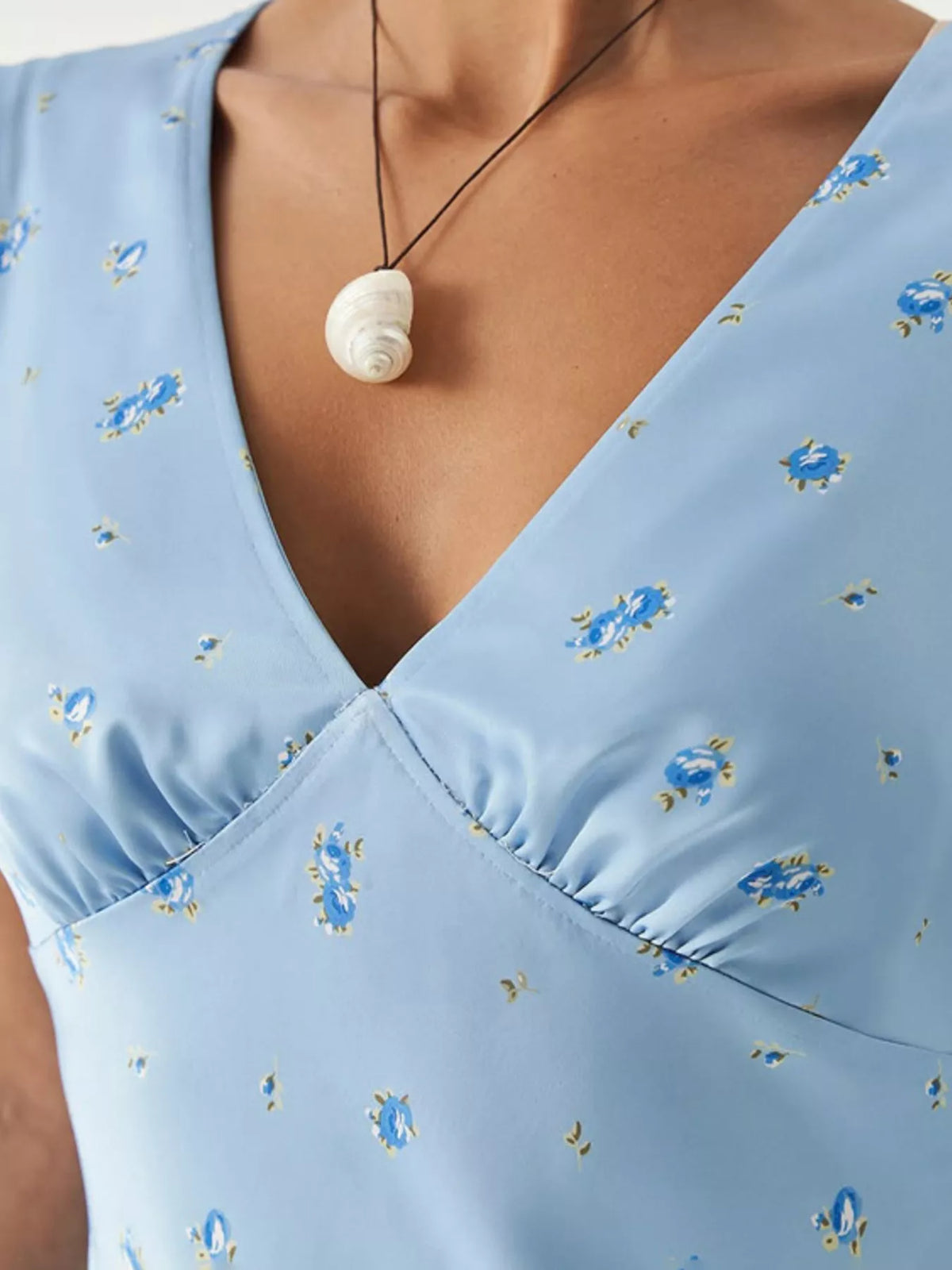 V neckline detail on the light blue maxi dress