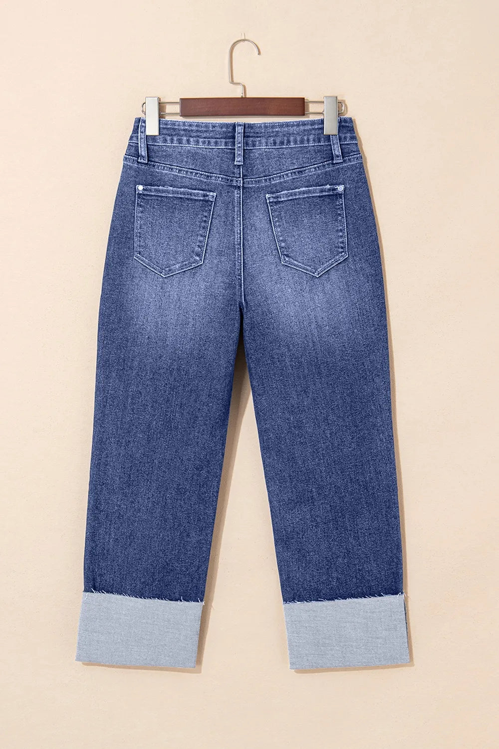 Folded cuff distressed jeans styled