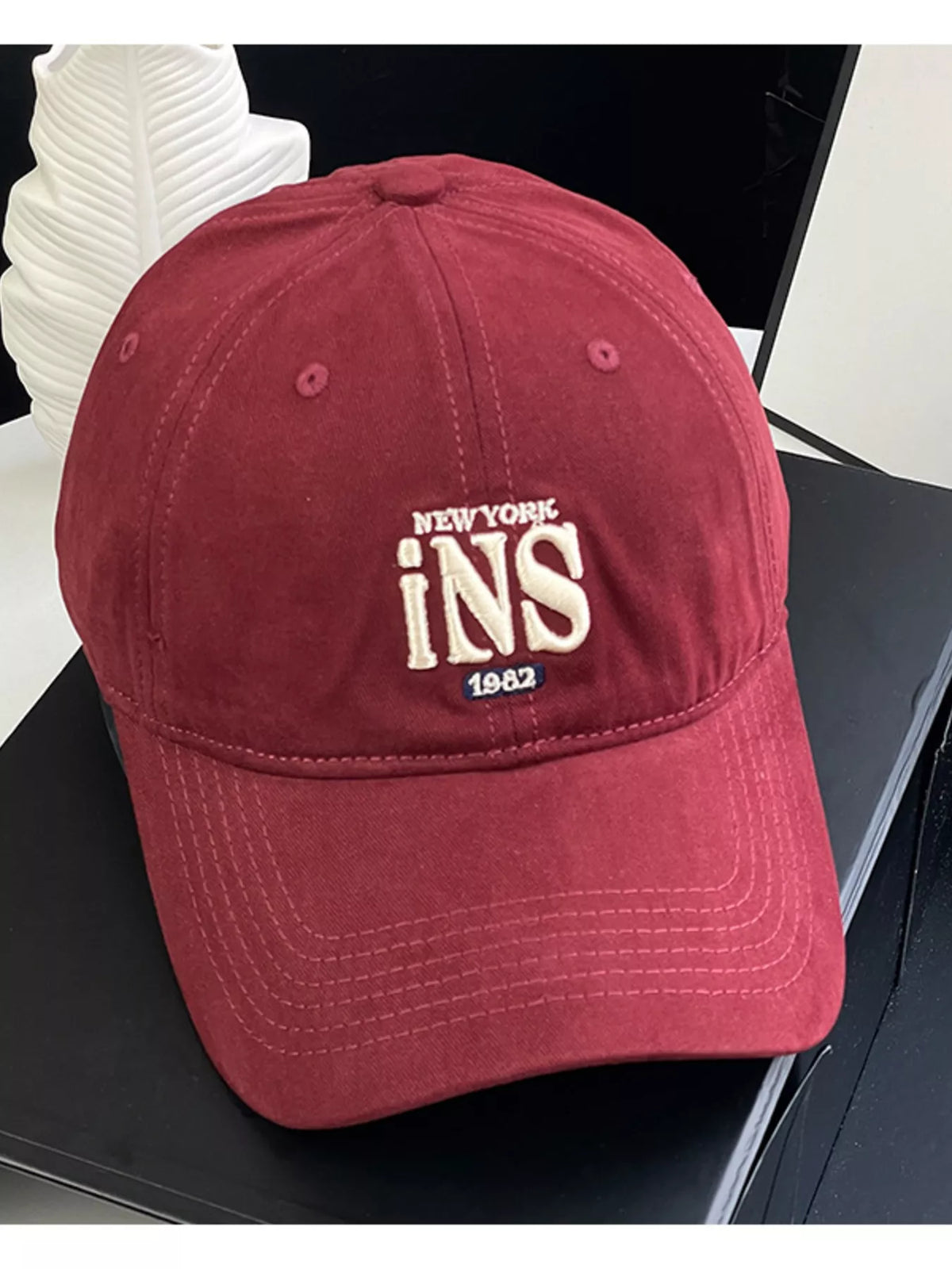 Embroidered cotton cap shown from above