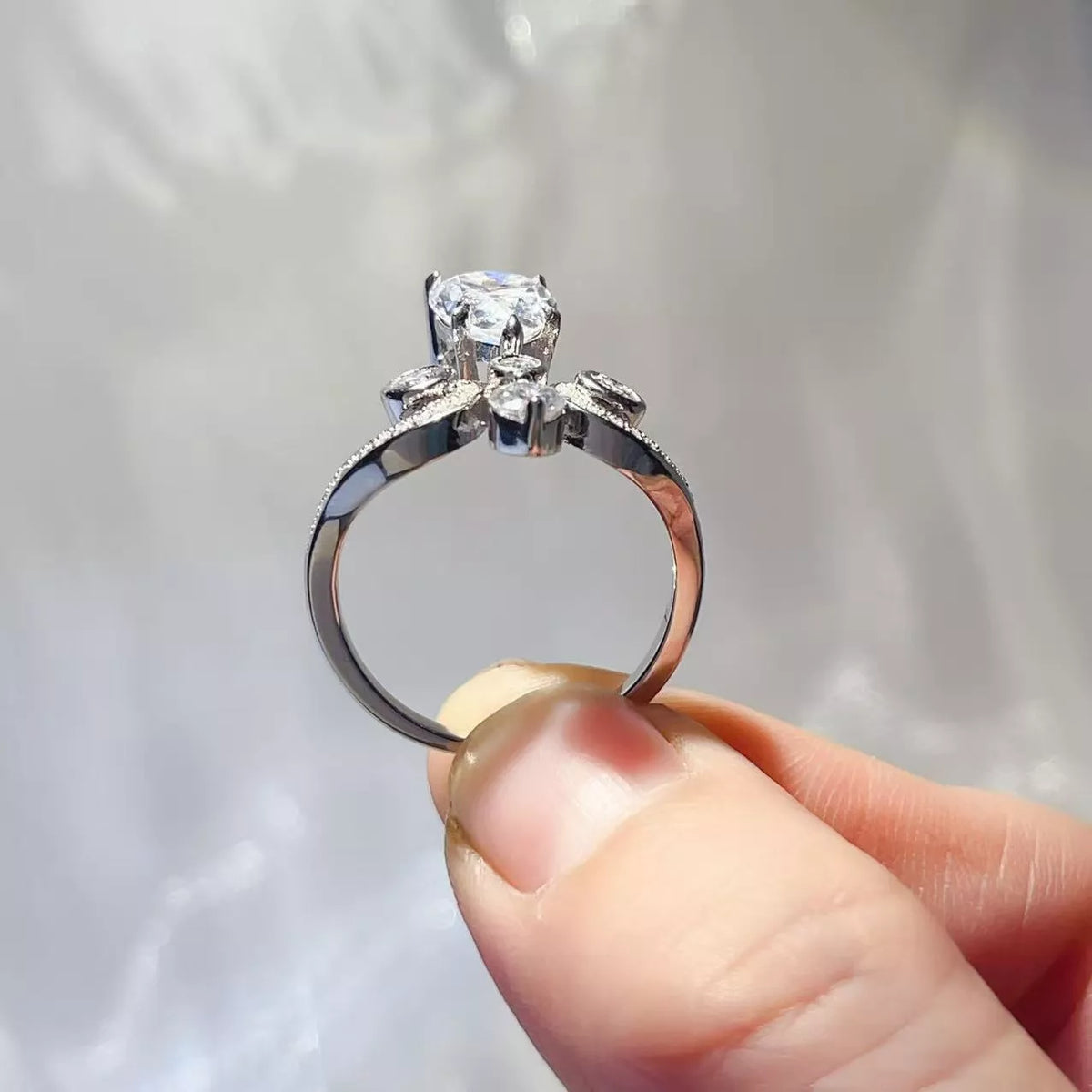 Moissanite ring angled view catching the light