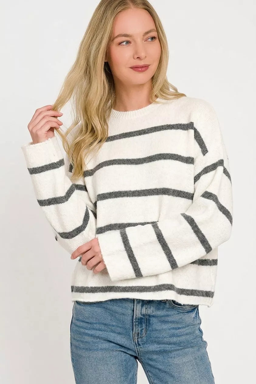 Striped wool blend sweater styled on model