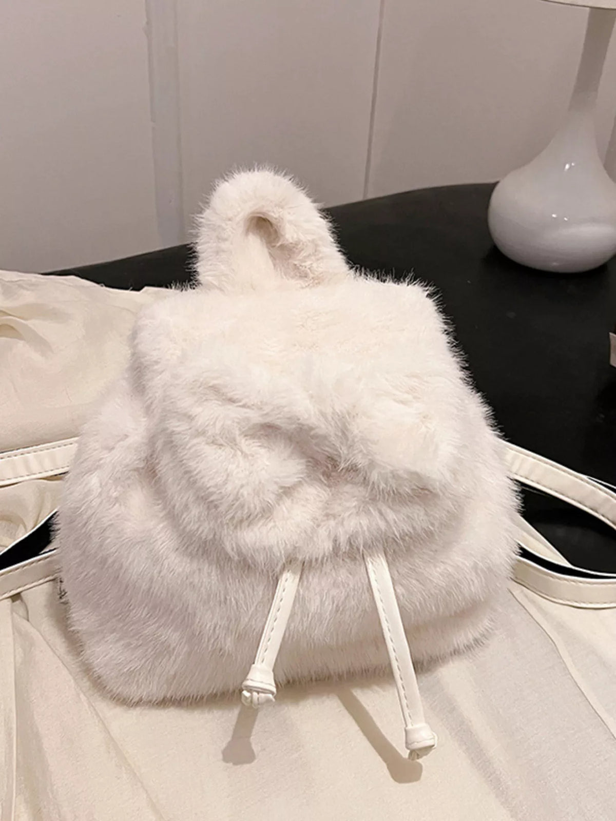 Fuzzy backpack styled with outfit