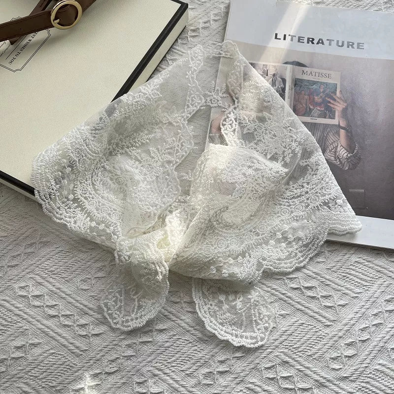 Feminine lace scarf shown in an off white tone
