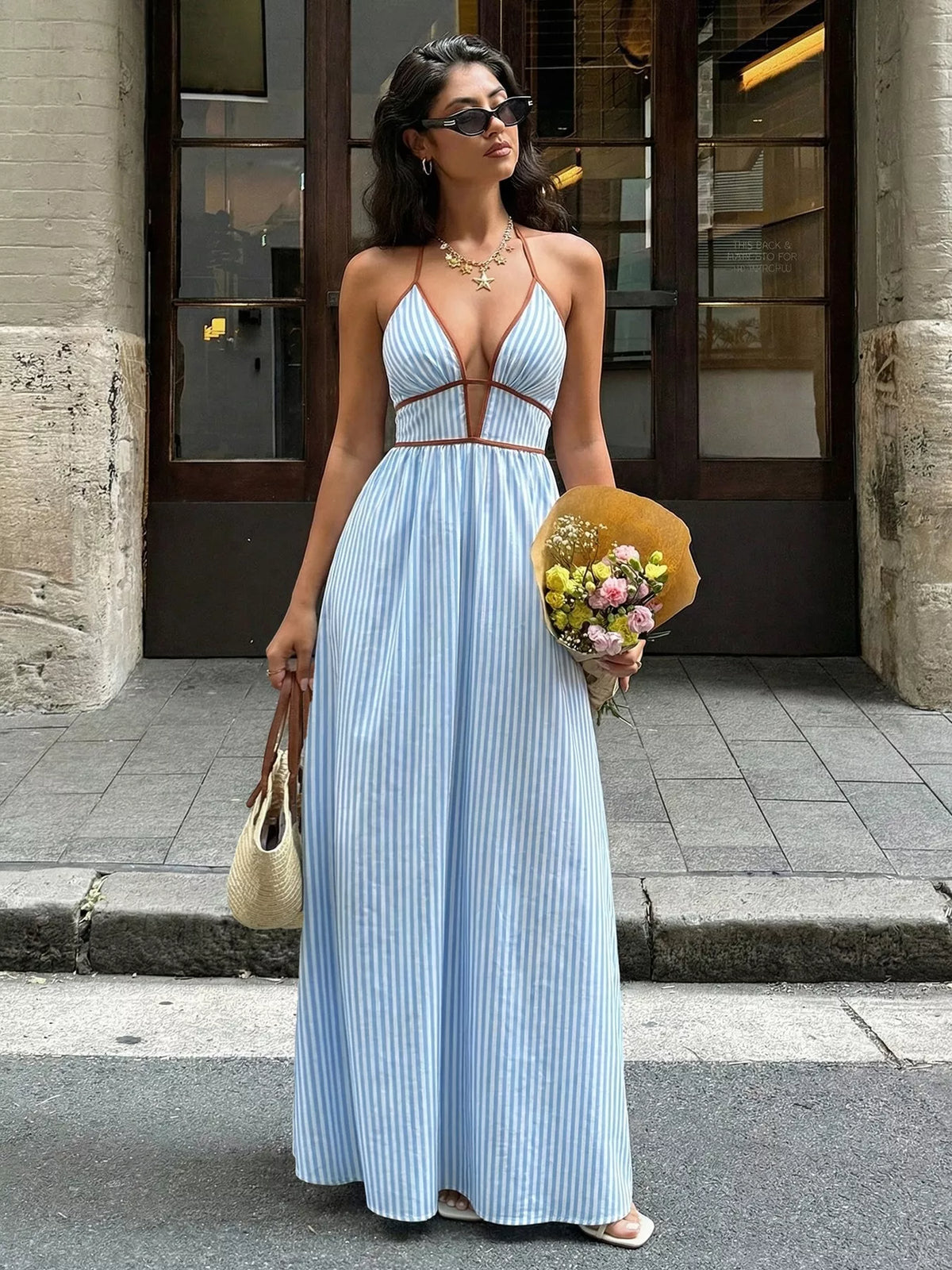 striped halter neck maxi dress styled on model
