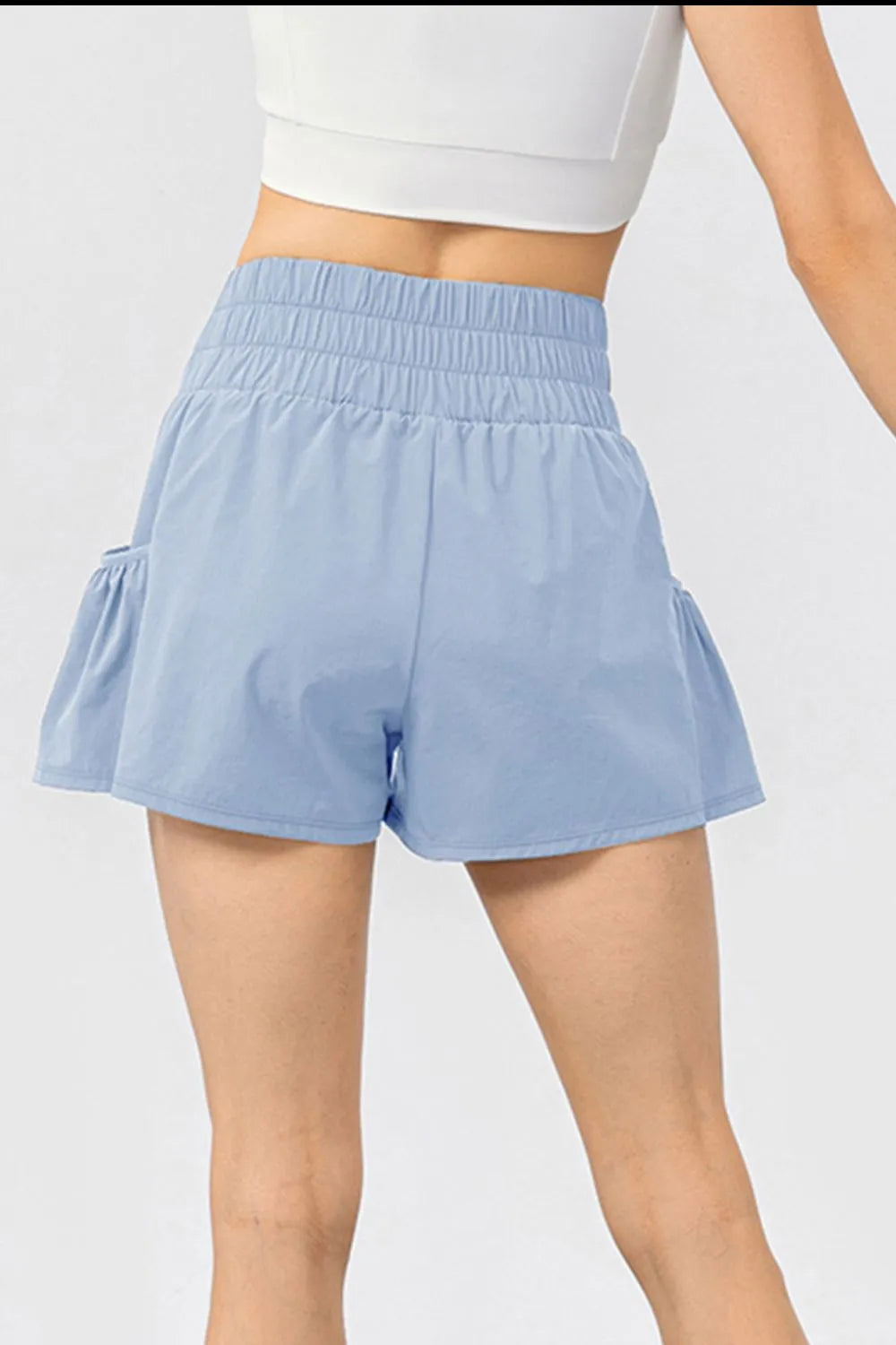 Elastic waist pocketed active shorts front view