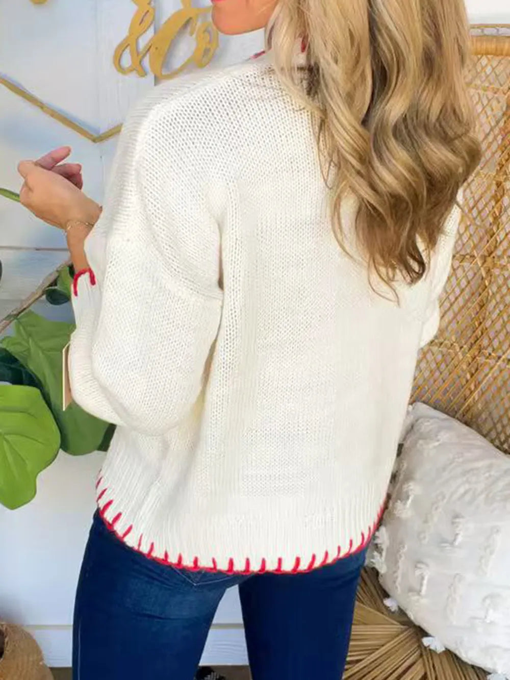 Ivory bow sweater detail