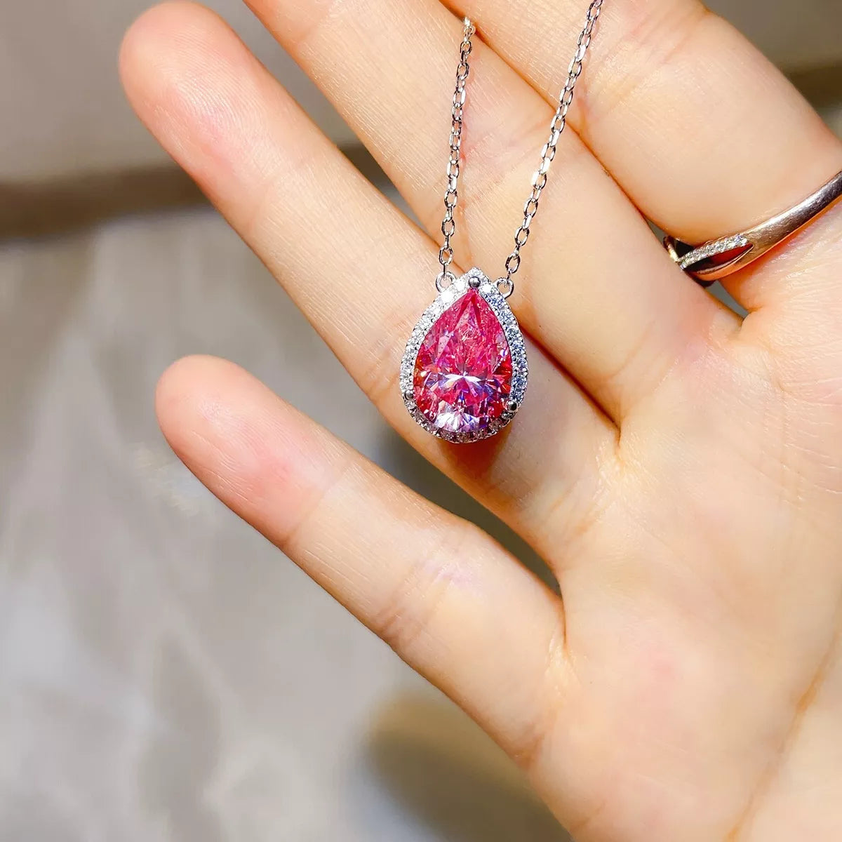 Sterling silver moissanite necklace worn at the throat
