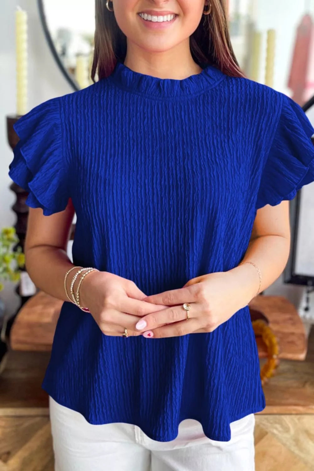 Navy textured ruffle trim short sleeve blouse back view