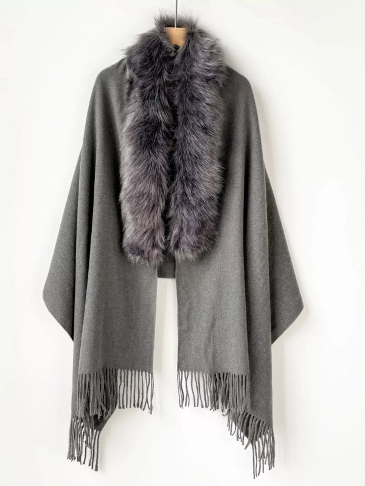 Faux fur scarf styled over a coat