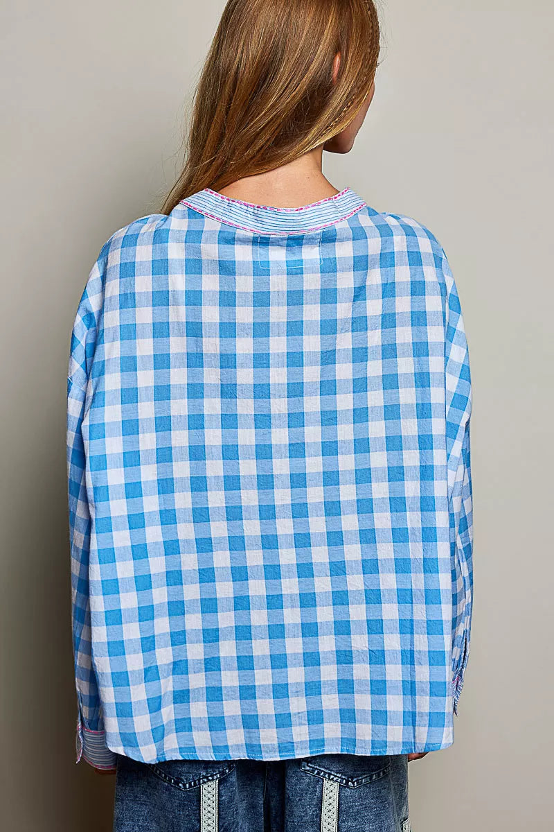 Side view of the loose fit cotton gingham blouse