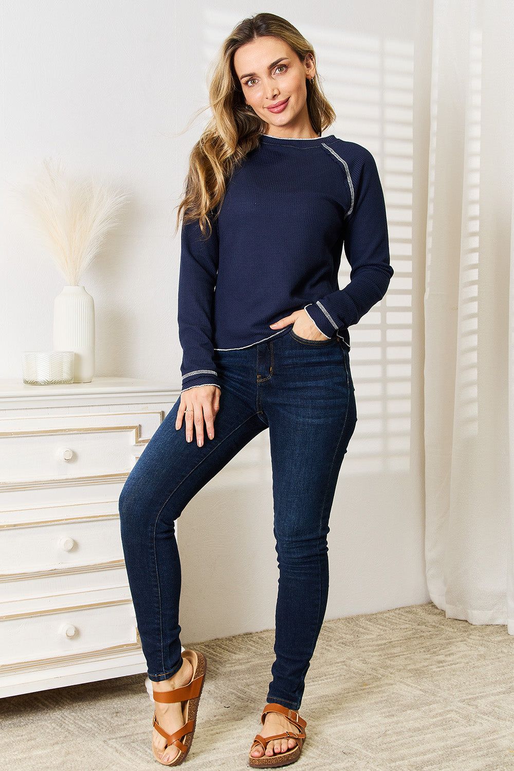Detail of the round neckline and knit fabric