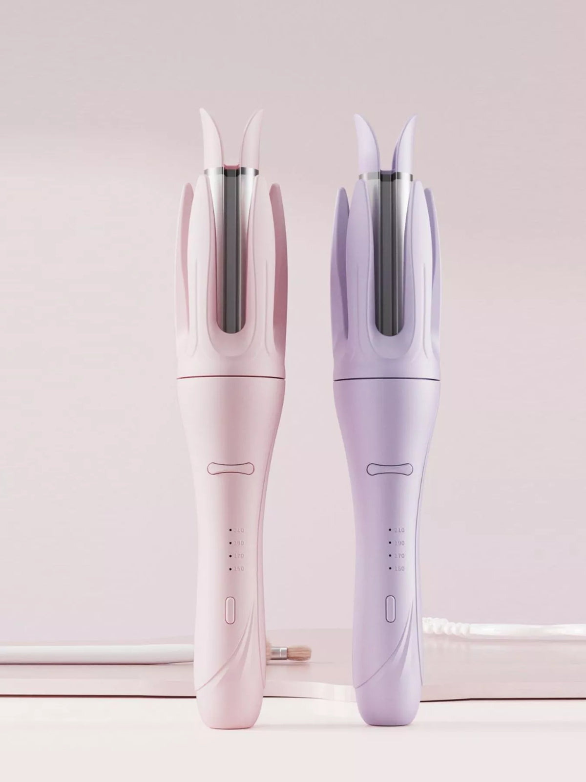 Automatic curling iron held in hand