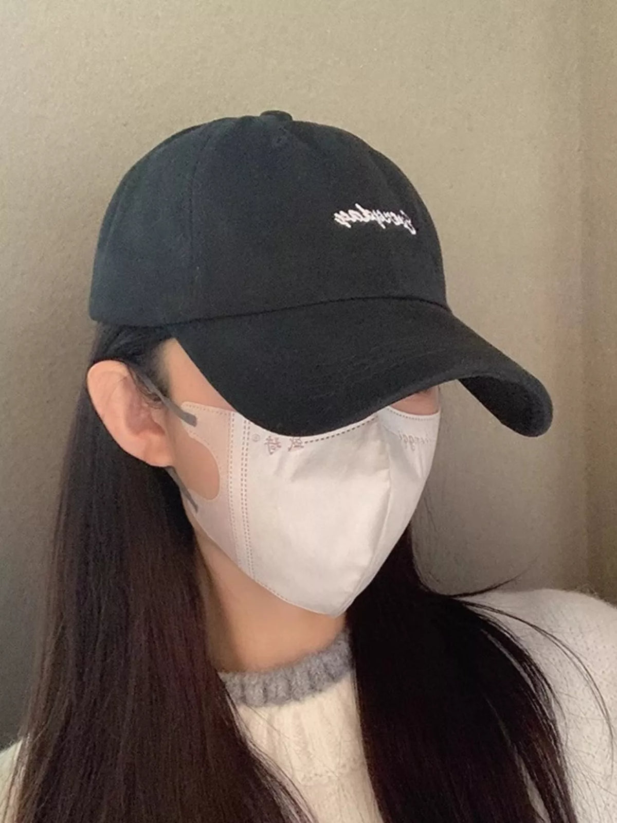 Black embroidered baseball cap front view