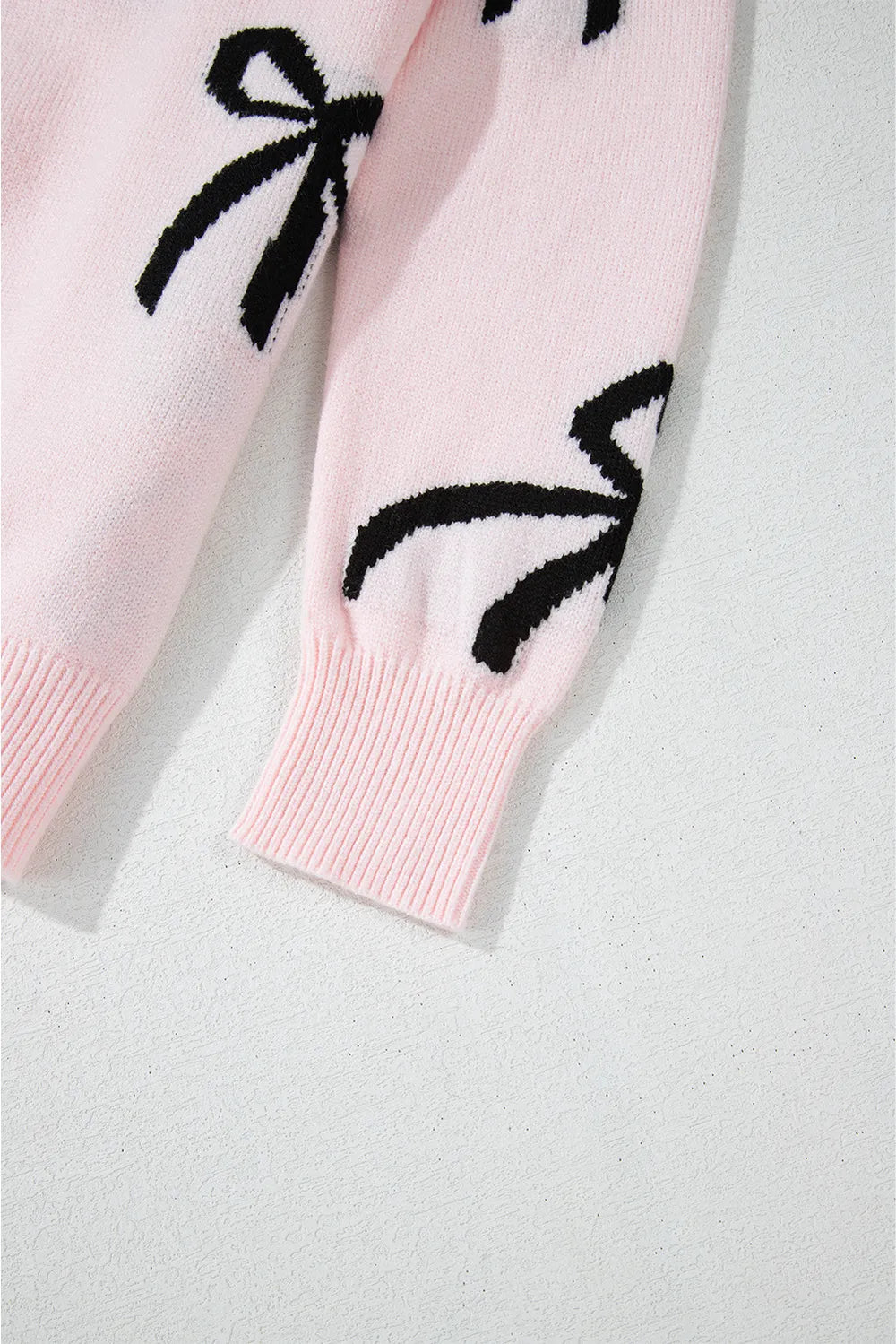 Loose fit bow sweater sleeve detail