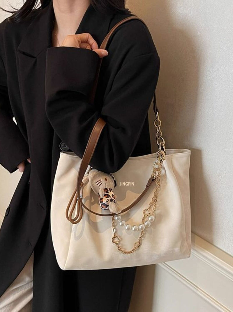 Cream suede pearl chain shoulder bag front view
