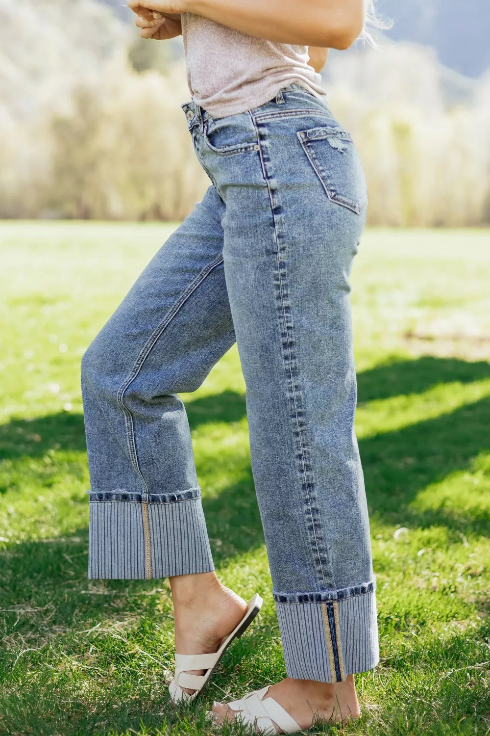 Side view of cuffed loose fit jeans